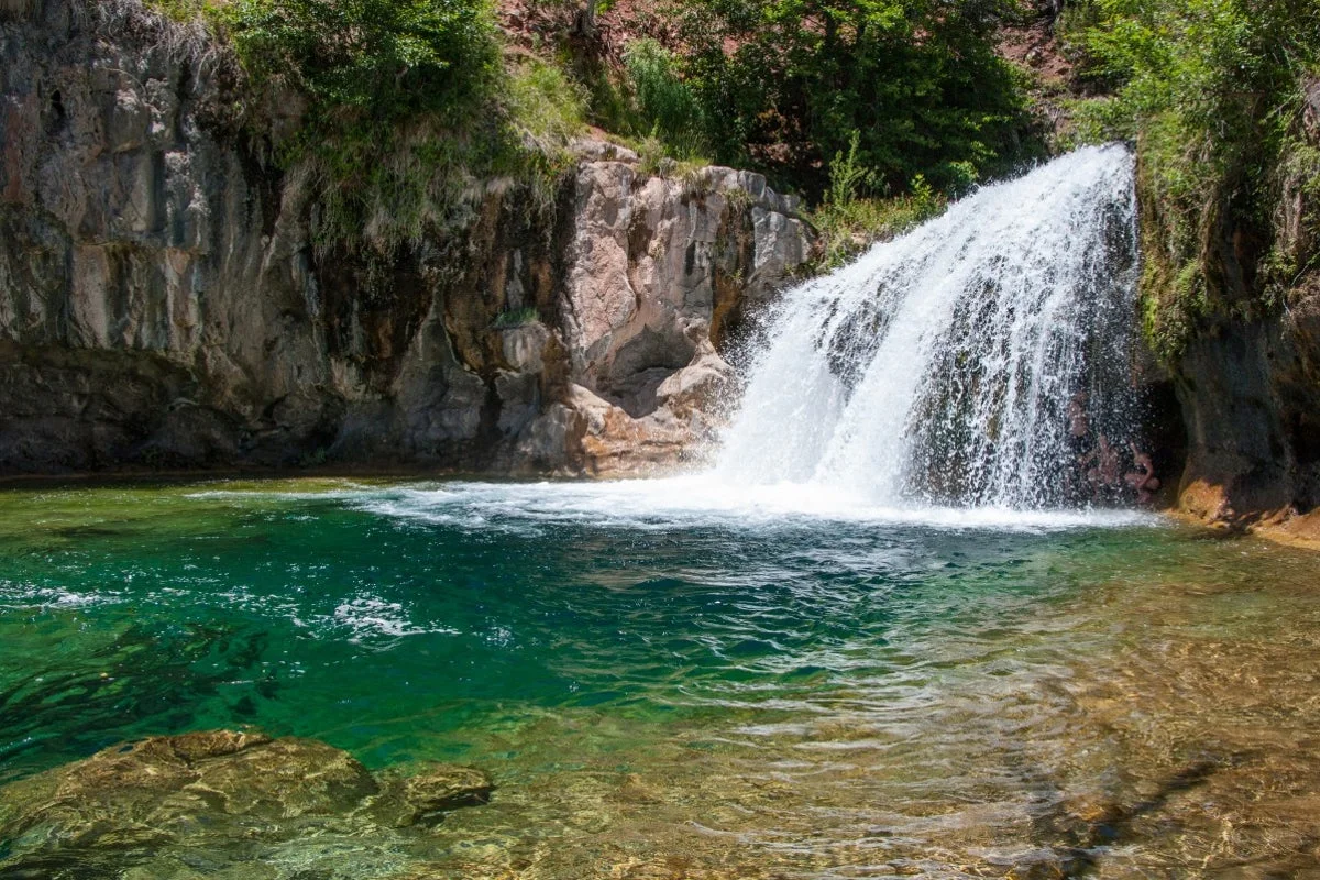 Man dies after jumping from 15-foot waterfall and being pulled under